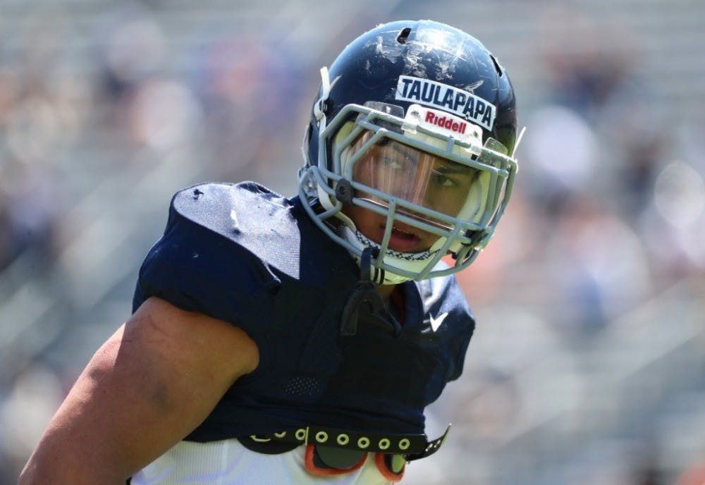 Sophomore running back Wayne Taulapapa stood out Saturday in the competition for the starting running back job.