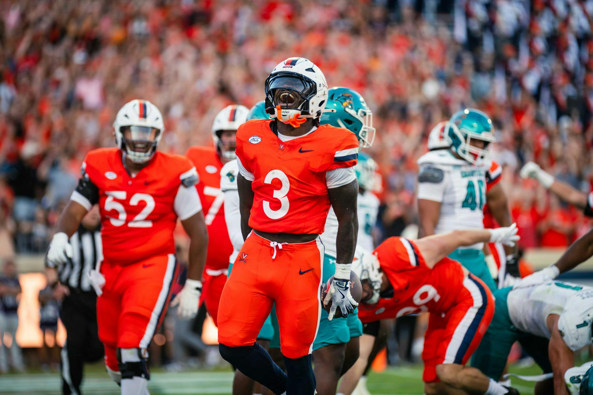 J'Mari Taylor celebrates another big play for Virginia.