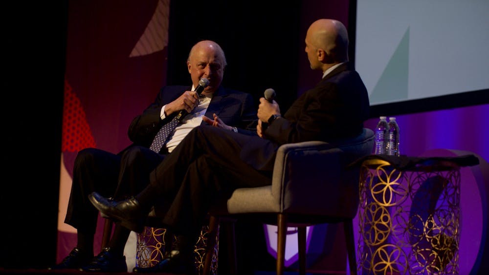 John Negroponte spoke at the TomTom Founder's Festival in April with Miller Center CEO William Antholis.