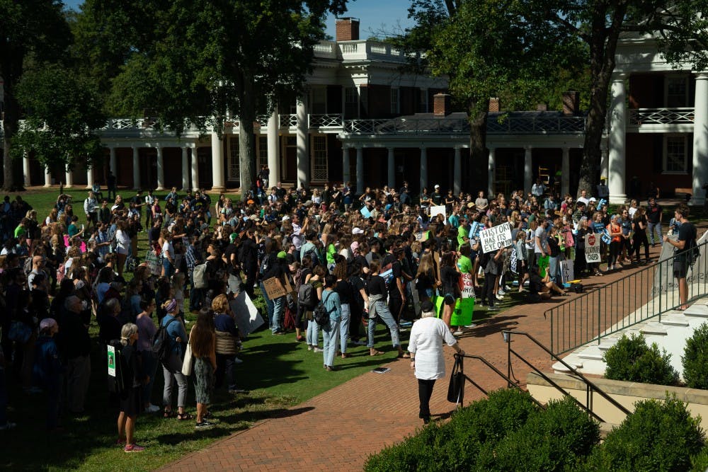 Hundreds of students, faculty and community members gathered near the Rotunda Friday to join the Global Climate Strike movement.&nbsp;
