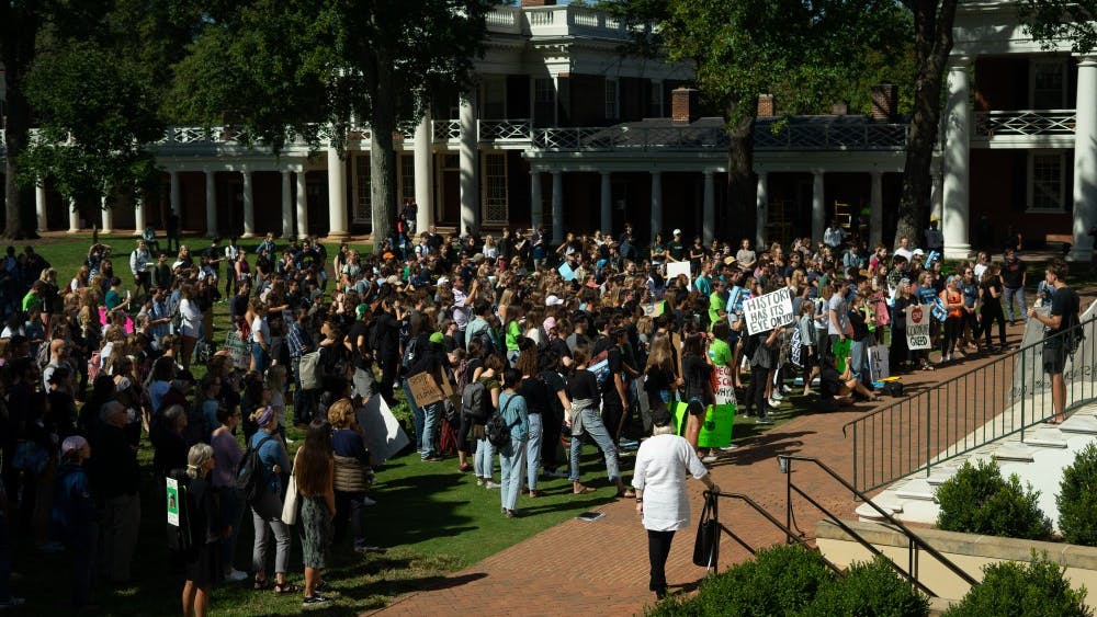 Hundreds of students, faculty and community members gathered near the Rotunda Friday to join the Global Climate Strike movement. 