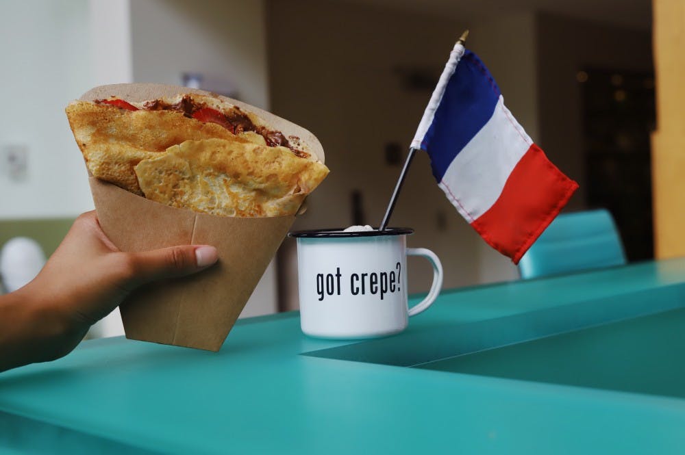 De Clippeleir holds her Nutella Strawberry crepe at the Crêpe Society's location in the iLab at Darden.