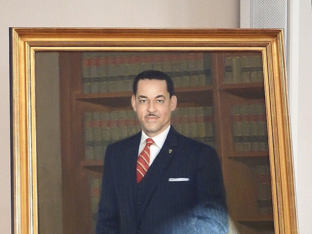 The portrait of Gregory Swanson features a plaque describing his successful lawsuit against the University for admission and his legacy as a the first African-American student and as an attorney.&nbsp;