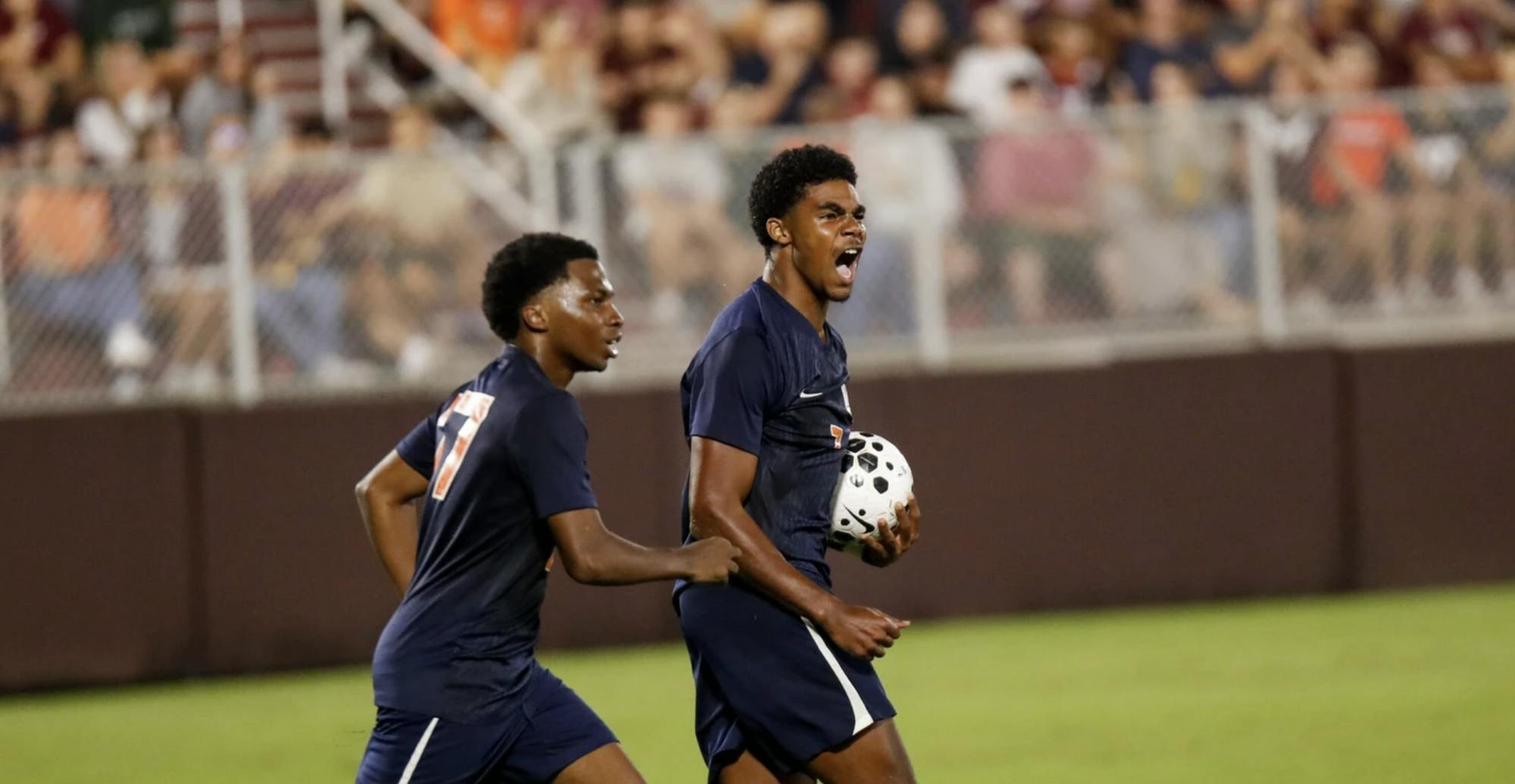 Freshman forward Nick Simmonds grabs the ball out of the net and roars after scoring a late equalizer.
