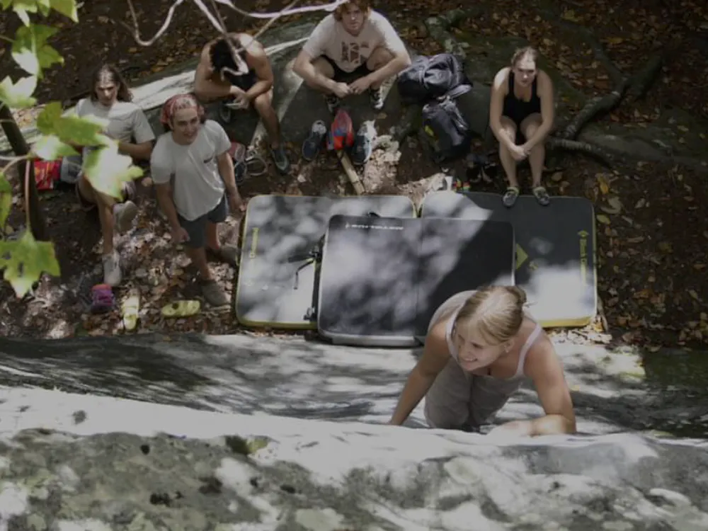 Hannah Russell ascends as her fellow climbers look on.