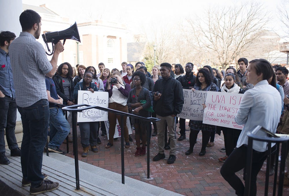 Students protest tuition hikes at a Board of Visitors meeting in 2015. &nbsp;