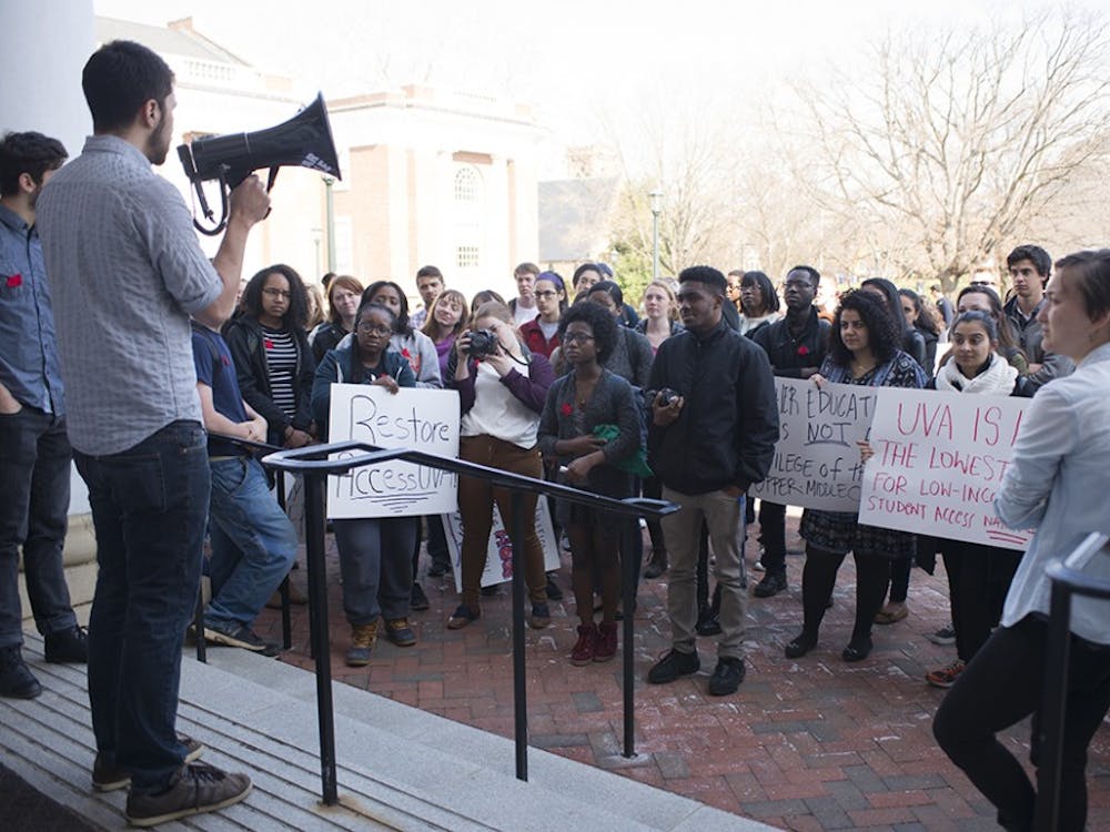 Students protest tuition hikes at a Board of Visitors meeting in 2015.  