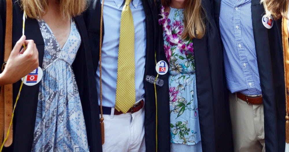 Graduates wearing the "#FreeOtto"&nbsp;stickers that were passed out.&nbsp;