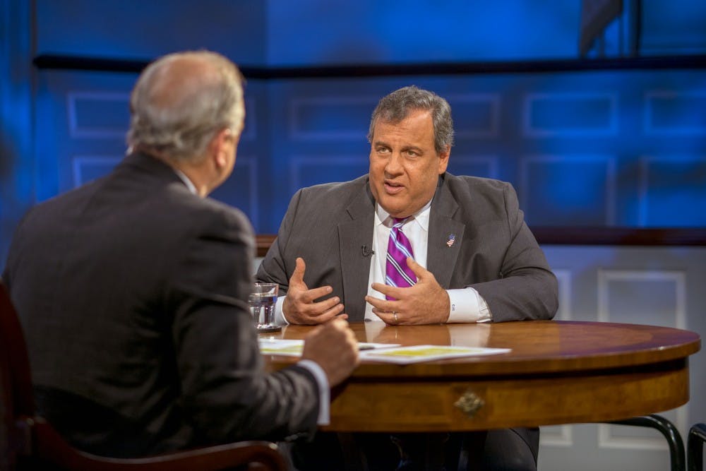 <p>Host Doug Blackmon engages with former New Jersey Gov. Chris Christie during an American Forum earlier this February.</p>