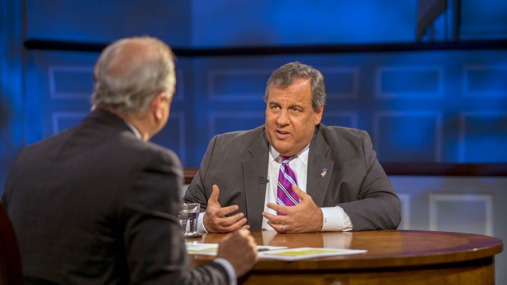 Host Doug Blackmon engages with former New Jersey Gov. Chris Christie during an American Forum earlier this February.