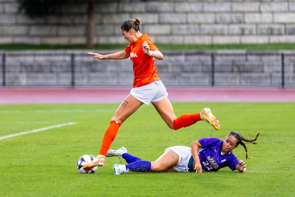 <p>Sophomore forward Allie Ross maneuvers around a James Madison defender during a 3-0 win Sept. 1.&nbsp;</p>