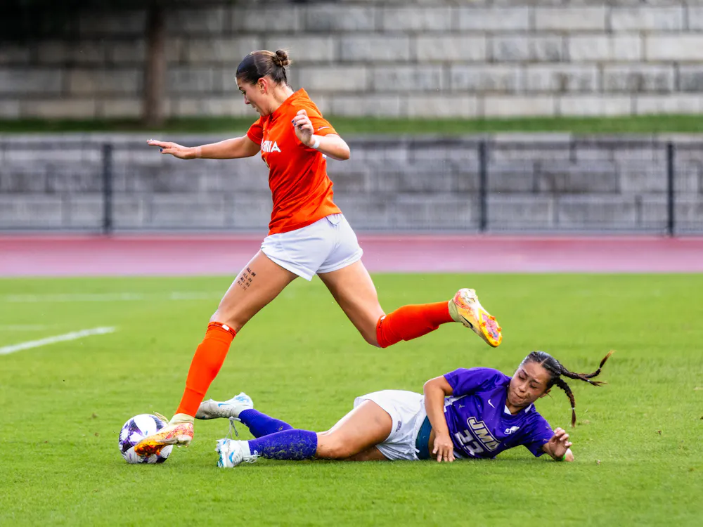 Sophomore forward Allie Ross maneuvers around a James Madison defender during a 3-0 win Sept. 1. 