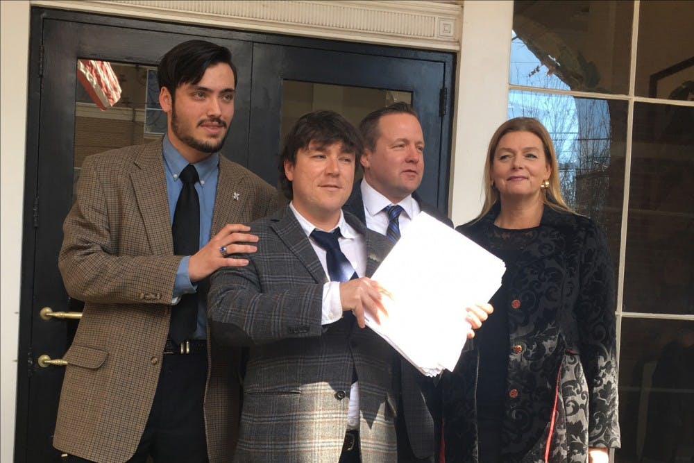 Kessler (middle) was sentenced to 50 hours of community service.