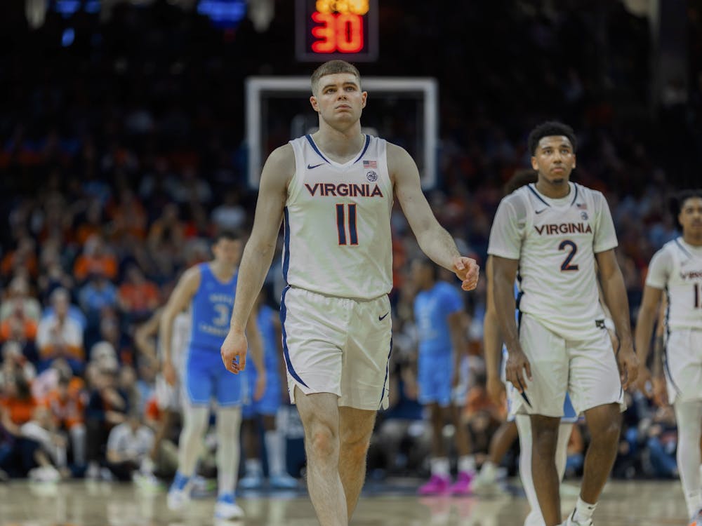 The Cavaliers exit from a timeout, trailing against North Carolina.