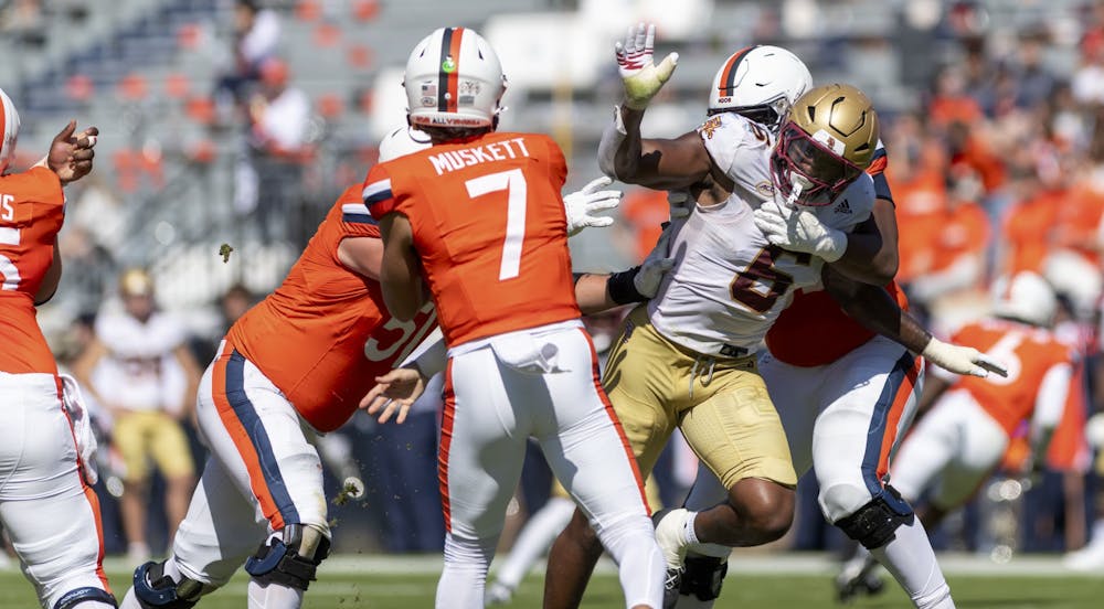 <p>Graduate quarterback Tony Muskett attempts a pass against Boston College Oct. 5.</p>