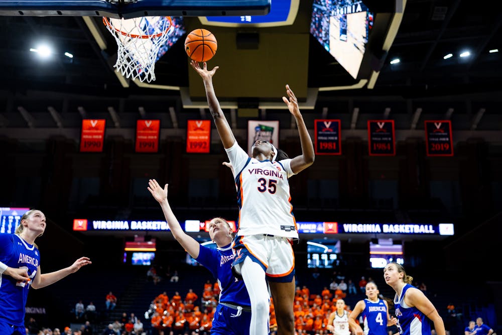 <p>Senior forward Latasha Lattimore barrels through the American defense for a layup.</p>