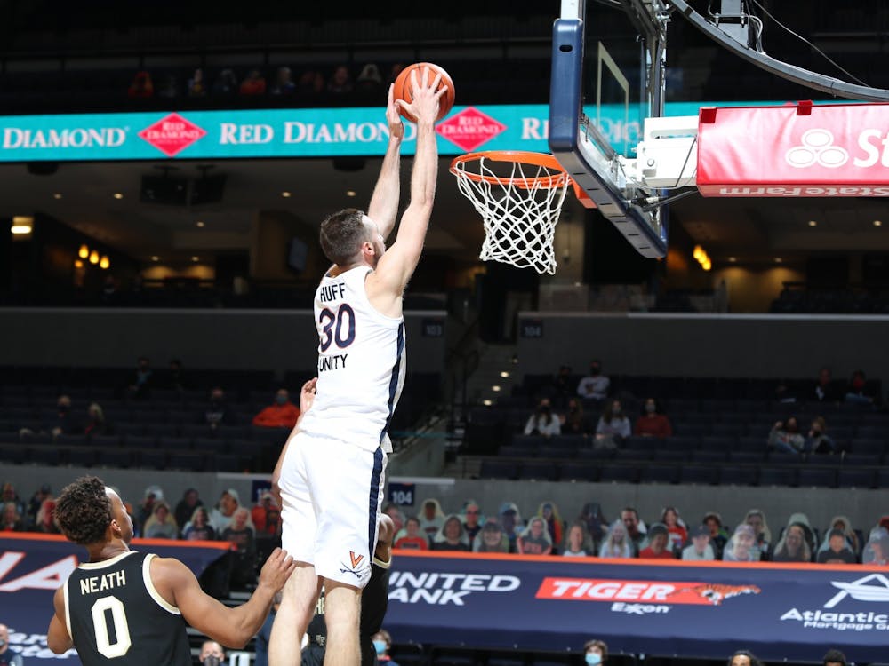 Senior forward Jay Huff was one of five Cavaliers to post double-digit point tallies, scoring 11 Wednesday night. 