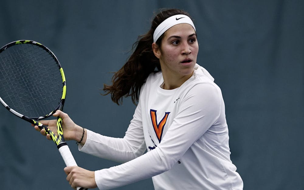 <p>Martina Genis Salas helped Virginia snag the doubles point and jump ahead, before the Wolverines gathered themselves and cruised.</p>