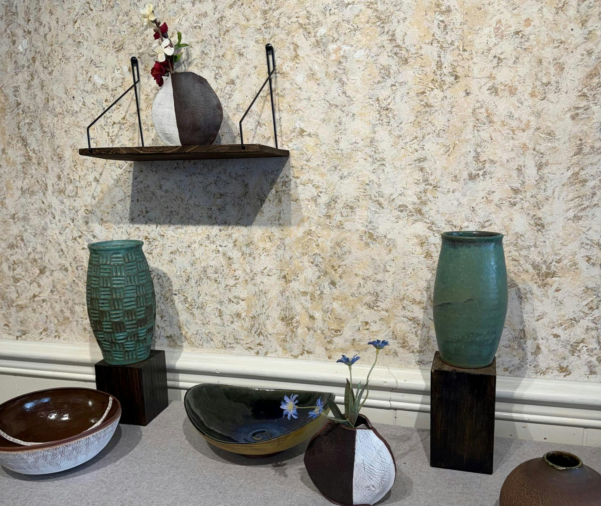 Her works include hand thrown vases, bowls and cups as well as ornate olive oil containers and other ceramic works that express her creative personality and artistic style.