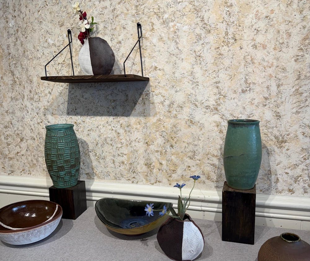 Her works include hand thrown vases, bowls and cups as well as ornate olive oil containers and other ceramic works that express her creative personality and artistic style.