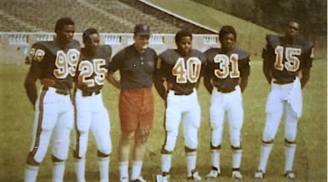 Stanley Land, Kent Merritt, John Rainey, Gary Ham and Harrison Davis pose at practice.