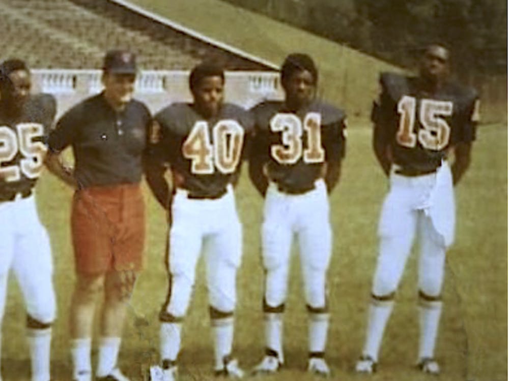 Stanley Land, Kent Merritt, John Rainey, Gary Ham and Harrison Davis pose at practice.