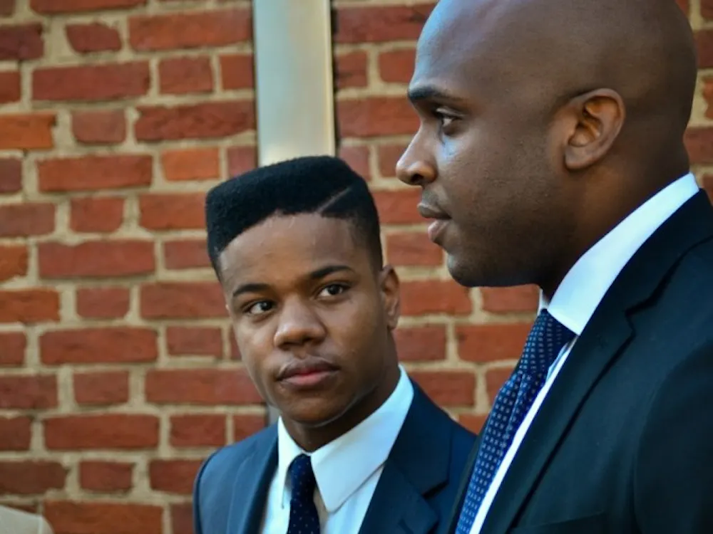 University Alumnus Martese Johnson (CLAS 2016) pictured (left)