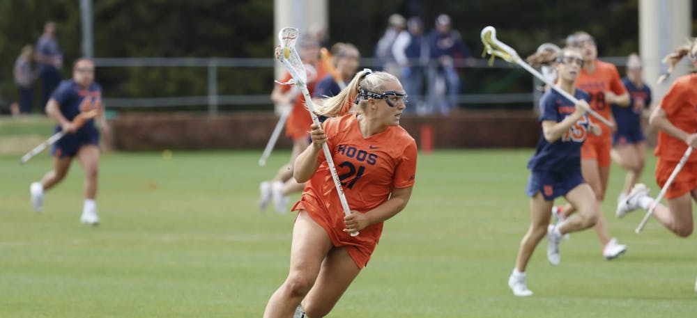 <p>Junior attacker Kate Miller dished out four assists Saturday in the Cavaliers' defeat to the Orange.&nbsp;</p>