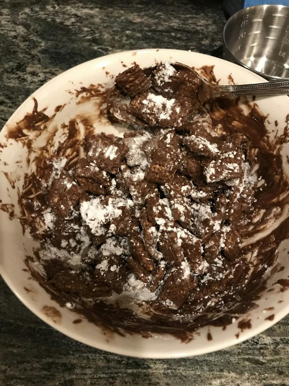 <p>Made up of Chex cereal, chocolate, peanut butter, and powdered sugar, the Muddy Buddies recipe is easy to make from the comfort of your dorm room.</p>