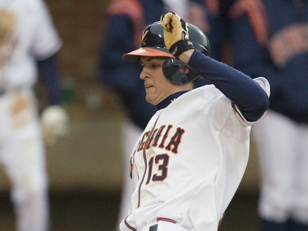 Virginia Cavaliers OF Jarrett Parker (13) slides in to home to score a run. The #16 ranked Virginia Cavaliers baseball team defeated the Siena Saints 17-2 at the University of Virginia's Davenport Field in Charlottesville, VA on February 29, 2008.
