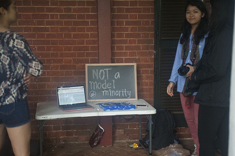 Early in the week, students are able to gather on the lawn and stand with a chalkboard message sharing their personal stories dealing with the stereotype.