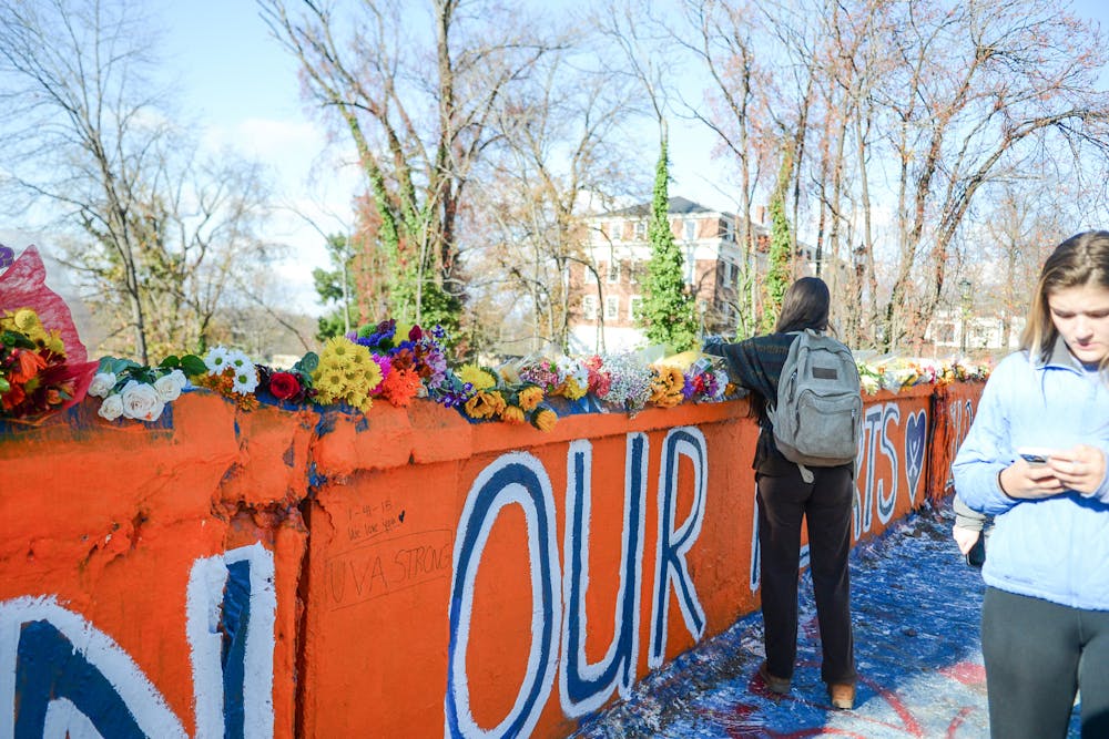 Hundreds of students painted Beta Bridge and wrote handwritten messages, enshrining the memories of Devin, Lavel and D’Sean and community support for their families in Charlottesville history.&nbsp;