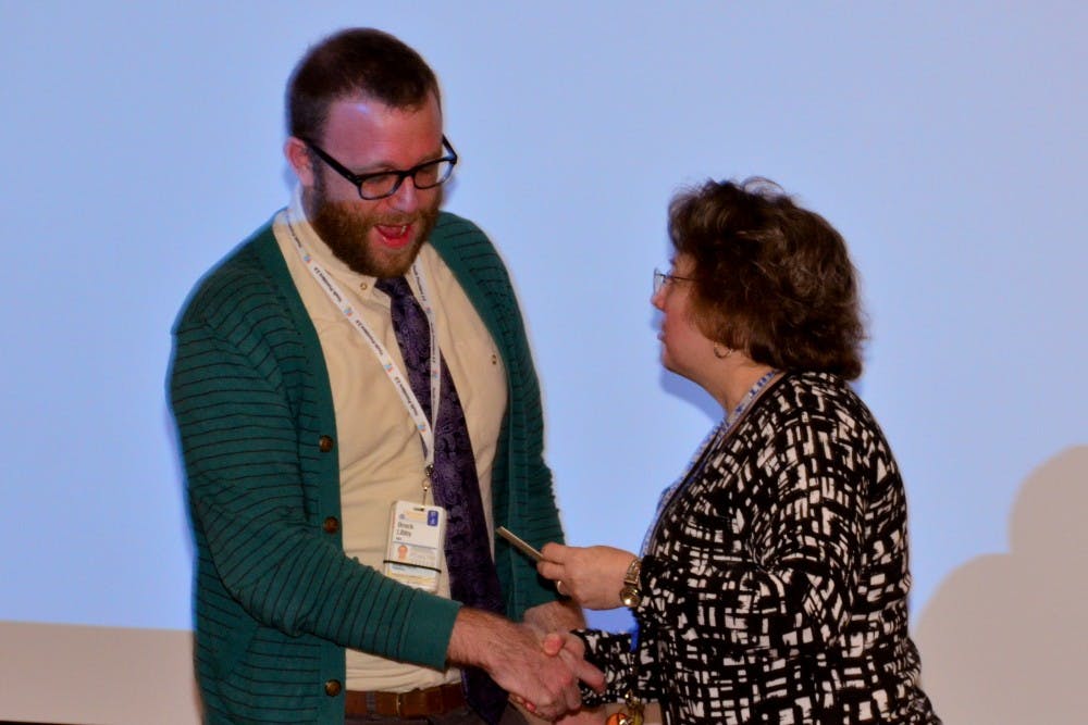 Pediatric resident Dr. Brock Libby receives the Nancy Walton Pugh Award for Child Advocacy for hiss work with LGBTQ youth programs.