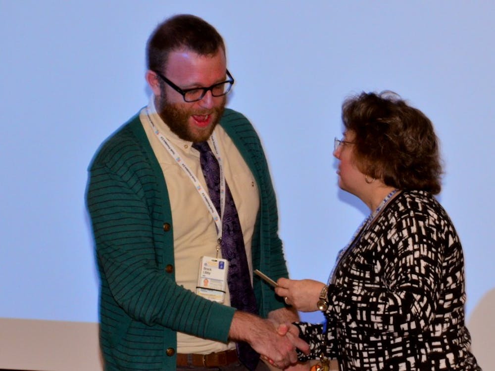 Pediatric resident Dr. Brock Libby receives the Nancy Walton Pugh Award for Child Advocacy for hiss work with LGBTQ youth programs.