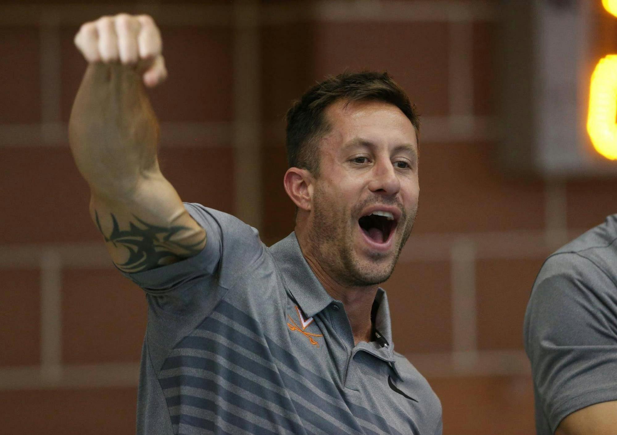 Fenwick encourages his Cavaliers at the Aquatic &amp; Fitness Center.