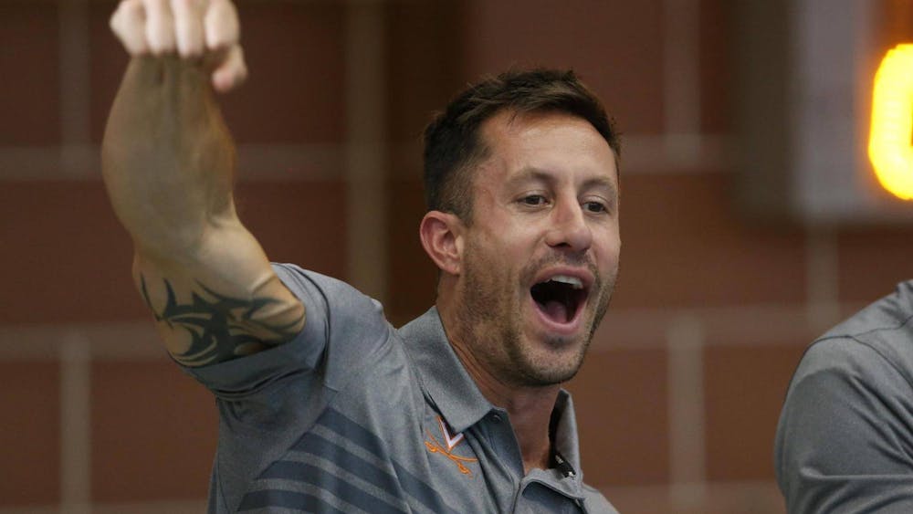 Fenwick encourages his Cavaliers at the Aquatic & Fitness Center.