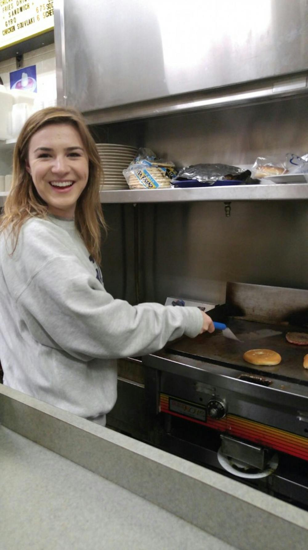 <p>Food columnist Molly Wright gets a chance to flip patties at The White Spot — a check off her U.Va. bucket list.</p>