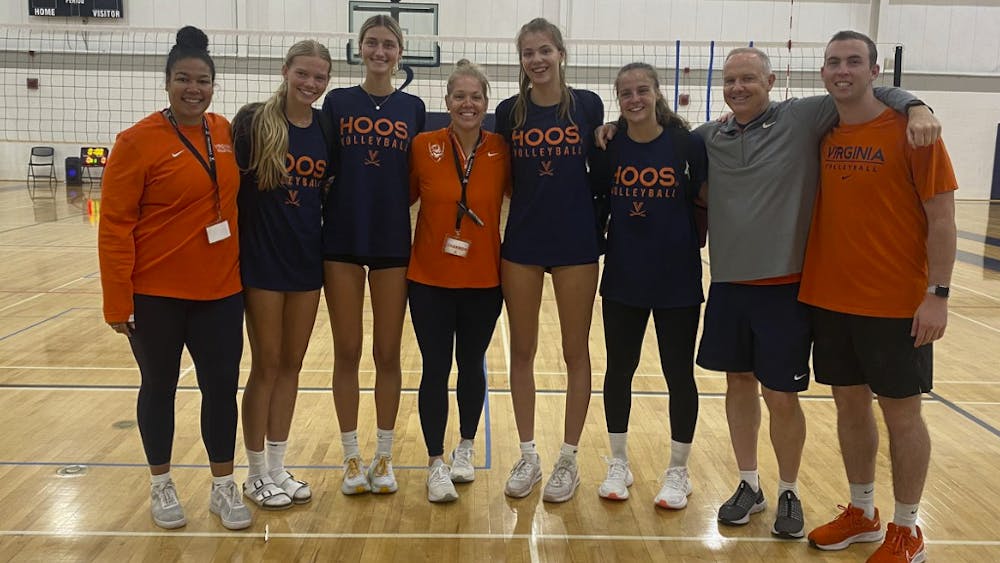 <p>Coach Shannon Wells with 2024 volleyball recruits.</p>