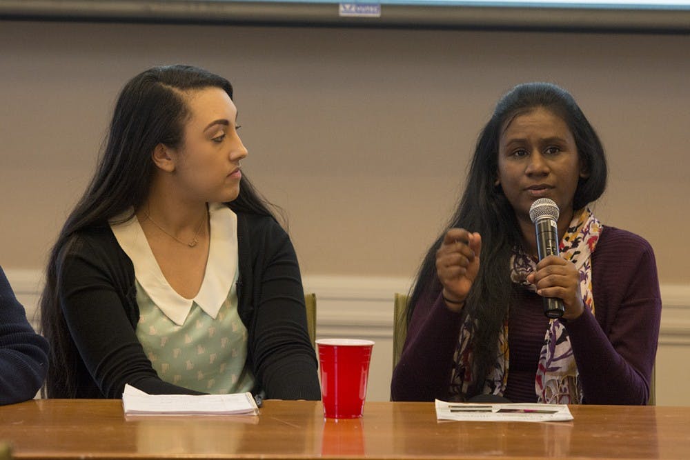 The four panelists included (from left) Halle Buckles — a fourth-year undergraduate student and the outgoing president of Native American Student Union — and Joanna Ajex — a member from the Women’s Initiative which provides mental health services to women.&nbsp;