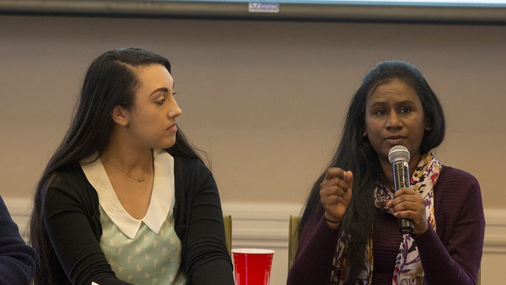 The four panelists included (from left) Halle Buckles — a fourth-year undergraduate student and the outgoing president of Native American Student Union — and Joanna Ajex — a member from the Women’s Initiative which provides mental health services to women.&nbsp;