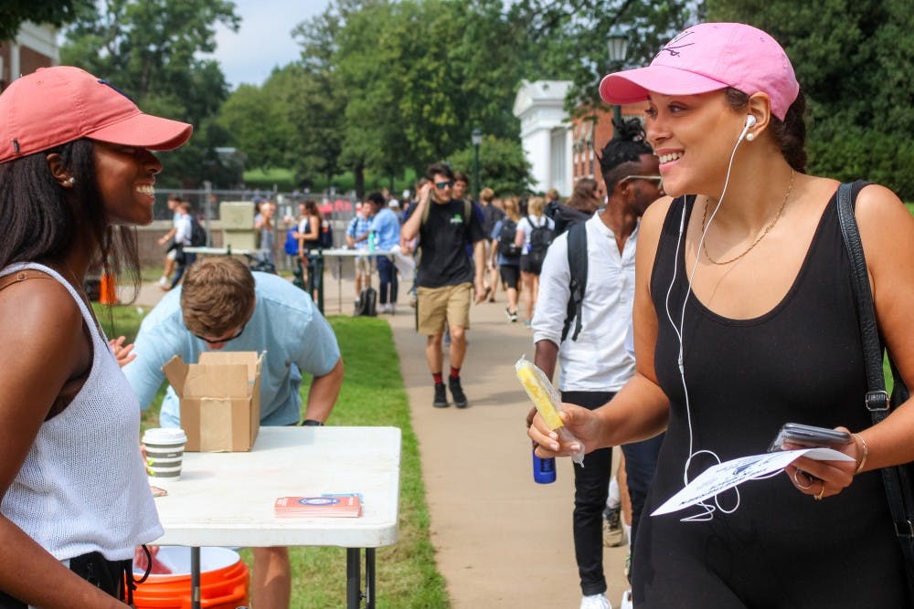 The Fourth Year Trustees Giving Campaign committee was stationed on the Lawn Thursday afternoon encouraging students to take two popsicles — one for themselves and another to gift to someone.&nbsp;