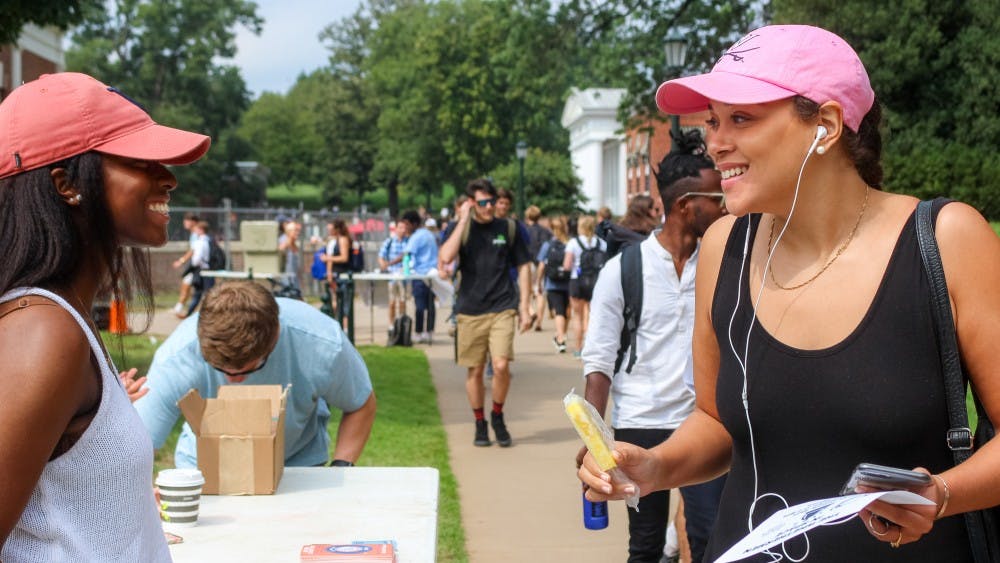 The Fourth Year Trustees Giving Campaign committee was stationed on the Lawn Thursday afternoon encouraging students to take two popsicles — one for themselves and another to gift to someone.&nbsp;