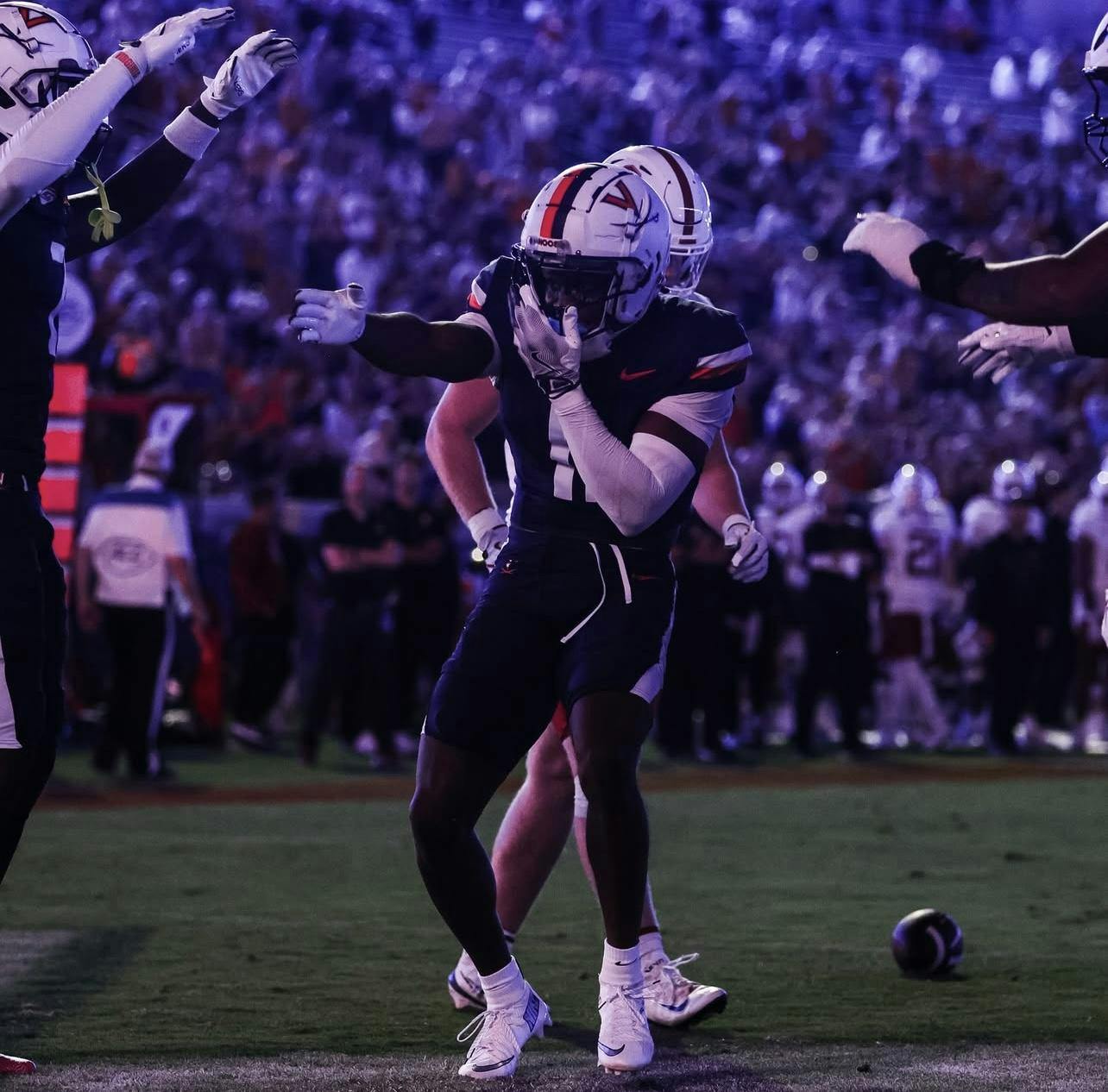 Harris celebrates one of his three touchdowns.