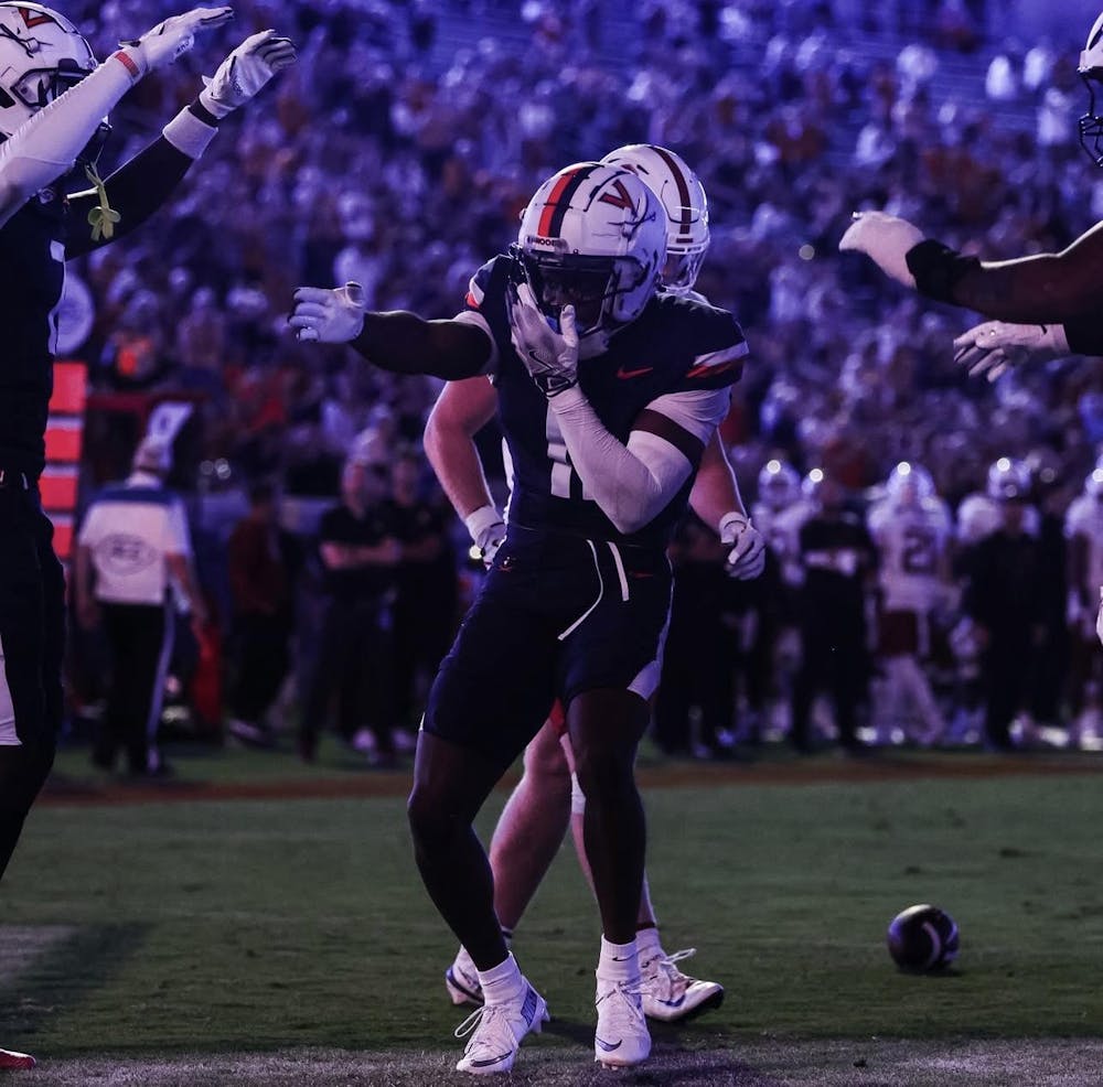<p>Harris celebrates one of his three touchdowns.</p>