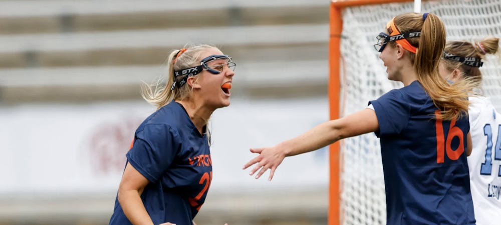 <p>Graduate student attacker Katia Carnevale celebrates her game-tying goal in the third quarter Wednesday.</p>