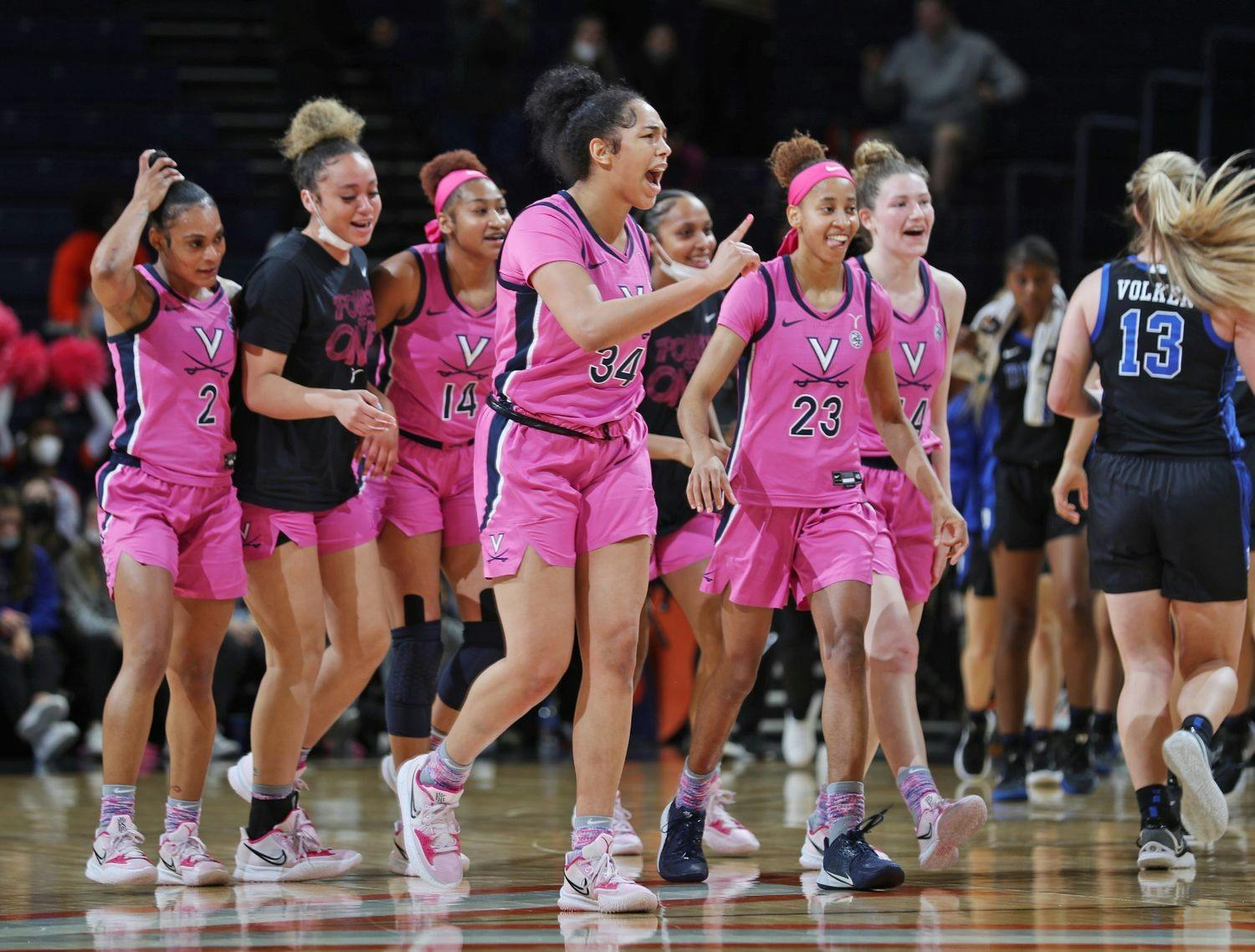The Cavaliers celebrate after earning their first ACC win of the season.