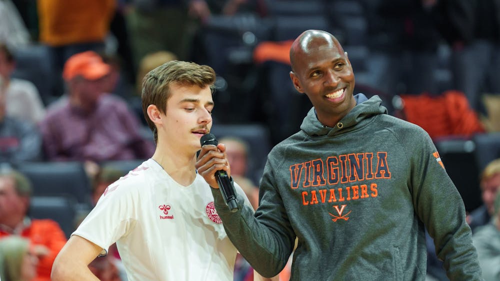 Hicks interviews a contestant during a halftime event at John Paul Jones Arena.