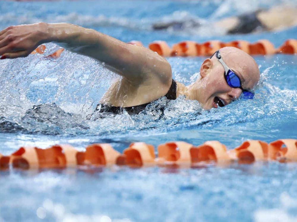 Hayes glides through the water against Virginia Tech Jan. 11.