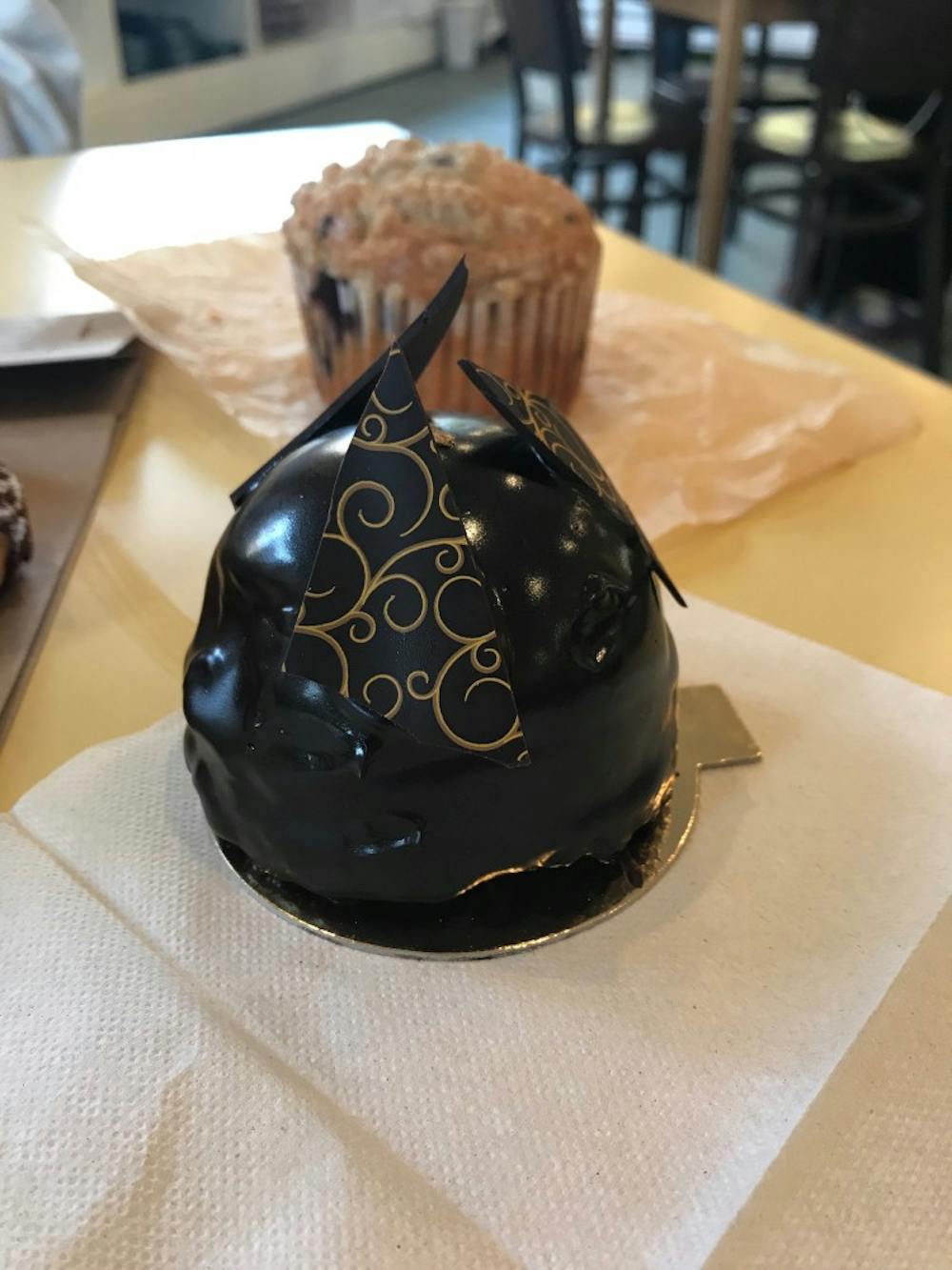 <p>The bakery's menu features the chocolate praline crunch dome, a rich and delightful blend of chocolate textures.</p>