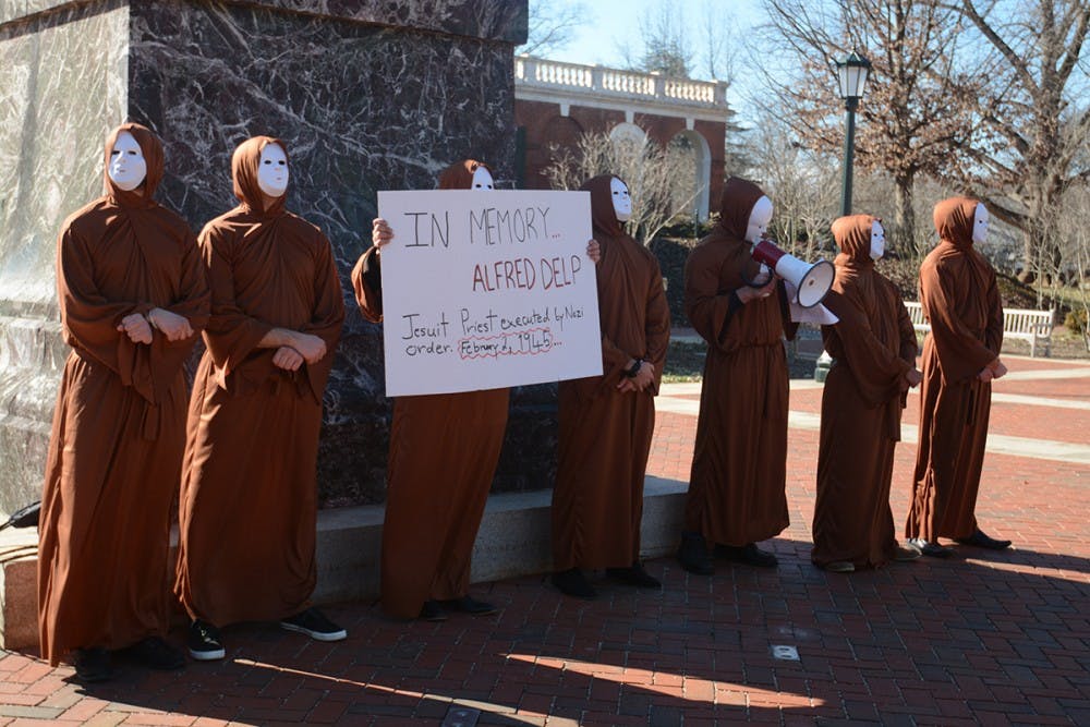 One of the demonstrators recited lines from reflections by Alfred Delp, who was a German Jesuit priest and leader of the Catholic resistance to Nazism.